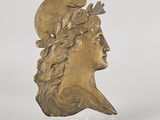 a gold bust of a man with a crown on his head