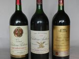 three bottles of wine that are sitting on a table