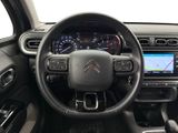 the interior of a car with a steering wheel and dashboard controls
