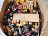 a cardboard box filled with assorted items on the floor