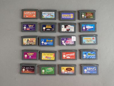 a lot of gameboy games on the table