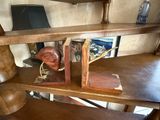 a wooden airplane with a leather seat on a desk