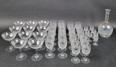 a lot of wine glasses and a vase on the table