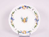 a white plate with a blue and yellow design on it