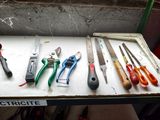 many different types of tools sitting on a table