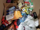 a cardboard box full of food and other items
