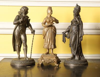 three statues that are sitting on a table