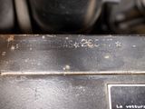 a close up of a metal object with writing on it