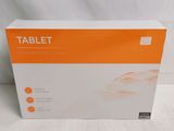 an orange and white box of a tablet on a white surface