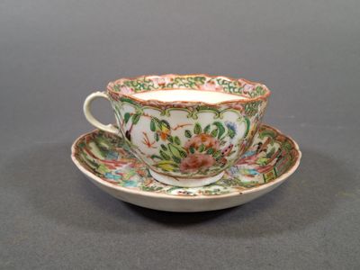 a cup and saucer on a saucer on a table