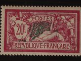 un timbre rouge et noir représentant un homme à cheval