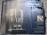 packaging of a delonghi coffee machine sitting on top of a table