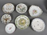 several plates with different designs and designs on them on a table