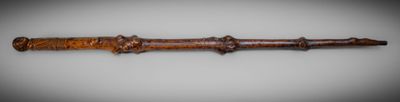 an image of a wooden stick on a white surface