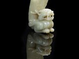 an image of a white jade carving of a man and a woman