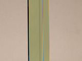 an image of a tall glass sculpture with a colorful stripe design