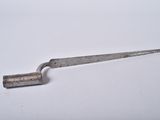 a small metal knife with a wooden handle on a white surface