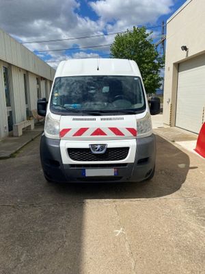 a white van parked in front of a building