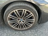a close up view of a car ' s tire on the road