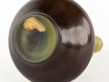 a close up of a black object on a white surface