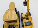 two toy vehicles that are sitting next to each other