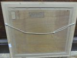 a picture of a piece of wood with a wire attached to it