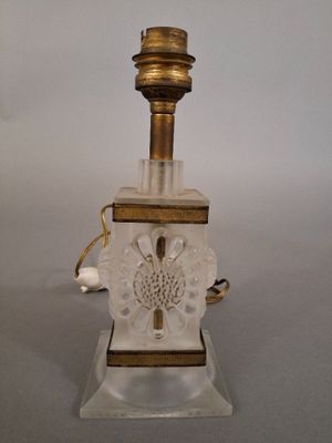 an image of a glass lamp with a gold base and a white base