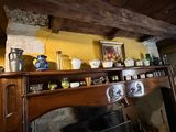 a fireplace in a room with a bunch of items on top of it