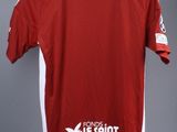the shirt is red and white with a white logo on it