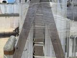 a wooden structure that has been wrapped up with plastic