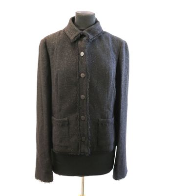 the jacket is gray and has a buttoned closure on the front