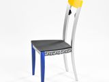 the back of a chair with a black seat and a yellow seat