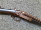 an old gun that is laying on the ground