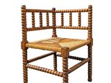 a wooden chair with a woven seat on a white background