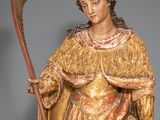 an image of a statue of a woman holding a staff