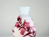 a vase that has a pink and white design on it