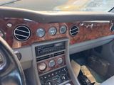 a dashboard of a car with many buttons and controls
