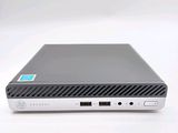 a close up of a small computer on a white surface