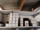 a shelf with boxes and boxes on it in a room