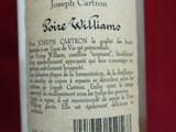 a bottle of wine that is sitting on a table