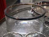 a silver tray with a glass bowl on top of it