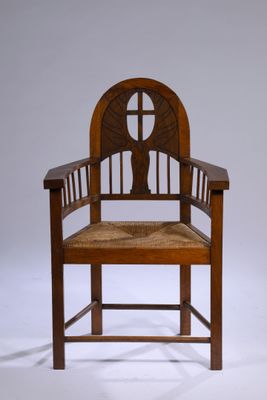 an image of a wooden chair with a woven seat and back rest