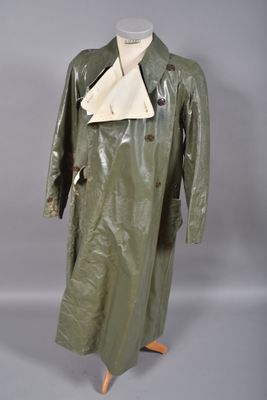 an image of a green trench coat on a mannequin mannequin mannequin mannequin mannequin mannequin mannequin manne