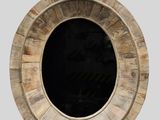 a picture of a round wooden object with a black hole in the middle