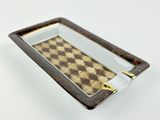 brown and white tray with a checkered pattern on it
