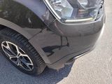 a close up of a car ' s headlight and front bumper