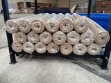 a pile of rolls of insulation sitting on top of a cart