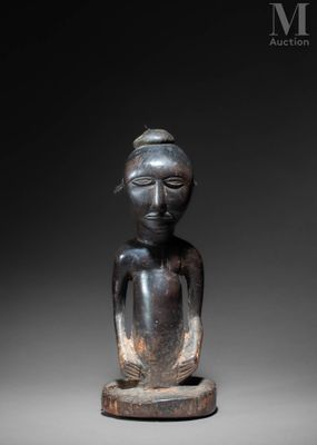 a statue of a woman with a hat on her head