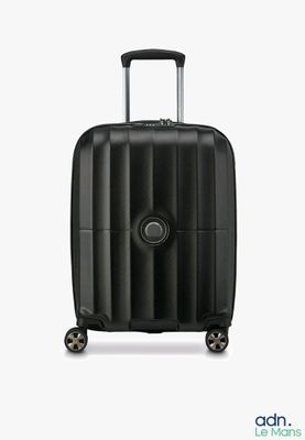 the black suitcase is sitting on wheels on a white surface