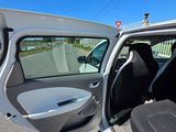 a white car with its door open on the street